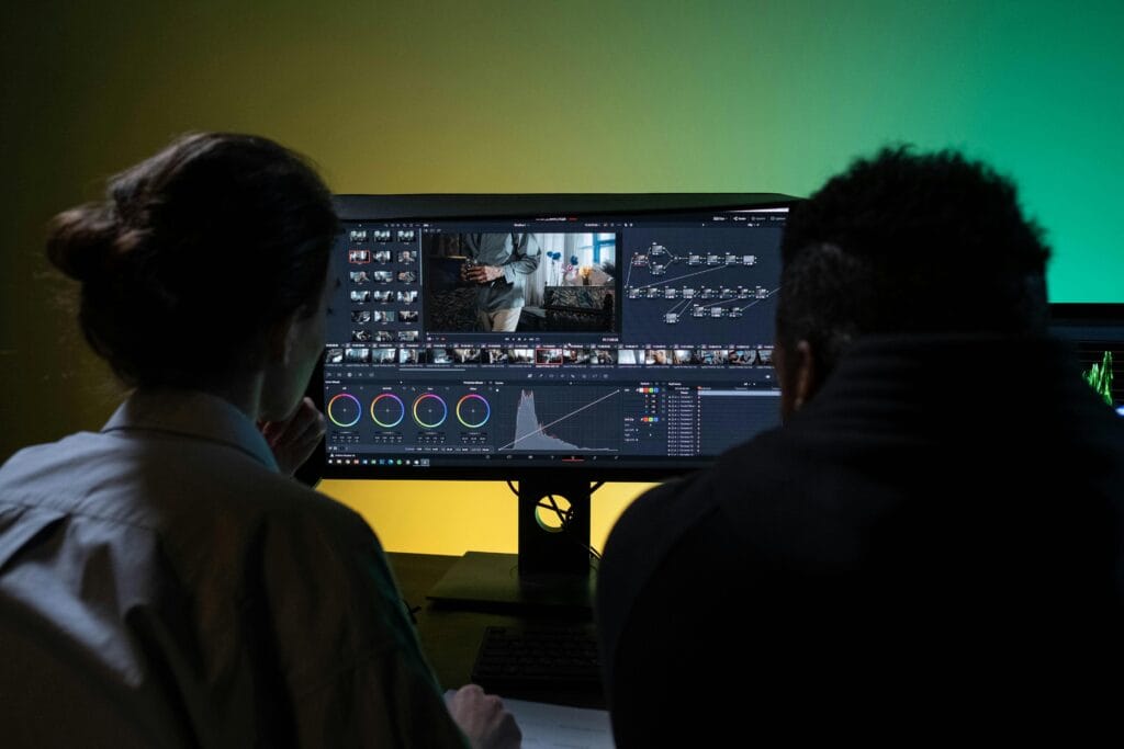 Image Editing team working on high-end dual-screen editing system